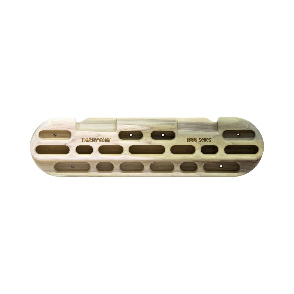 Front view of the Beastmaker 1000 Series Fingerboard, featuring a variety of jugs, slopers, and pockets for comprehensive grip training.