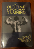 My Oldtime Strongman Training by Robert “Eisenhans” Spindler, front cover featuring a very muscly man showing off his muscles.